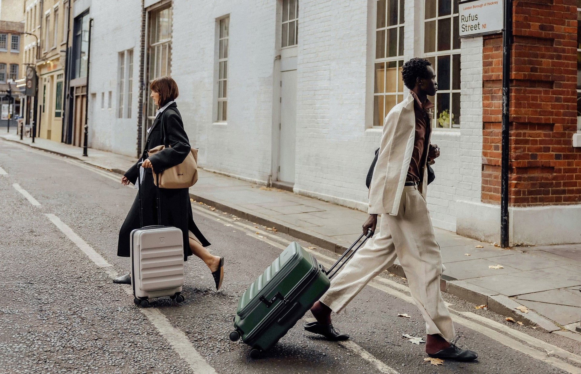 Two travellers exploring the city with luggage